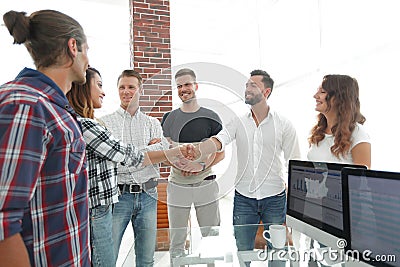 Handshake partners in the creative office Stock Photo