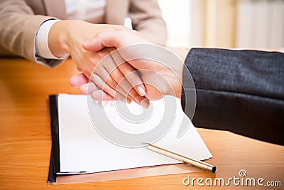 Handshake of a woman`s and a man`s hand Stock Photo