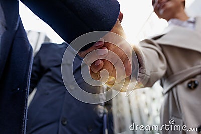 Handshaking business person in office as teamwork and partnership. Stock Photo