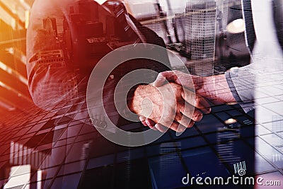 Handshaking business person in office. concept of teamwork and partnership. double exposure Stock Photo