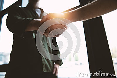 Handshaking business person in office. concept of teamwork and partnership. Stock Photo