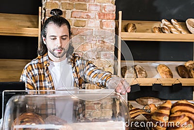 handsome adult seller working Stock Photo