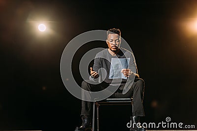 African american actor holding scenario on Stock Photo