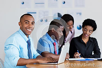 Handsome african american businessman with business team at office Stock Photo