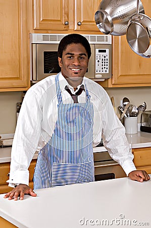 Handsome African-American businessman in kitchen Stock Photo