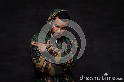 Handsome African-American guy wear military jacket. Stock Photo