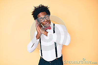 Handsome african american man with afro hair wearing hipster elegant look sleeping tired dreaming and posing with hands together Stock Photo