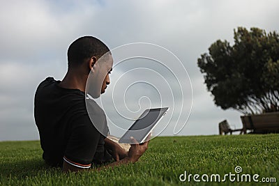 Handsome African American man reading Stock Photo