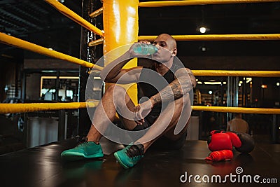 Handsome African male boxing fighter training at the gym Stock Photo