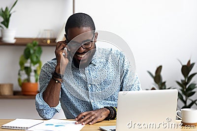 Black manager makes business call talking with client Stock Photo