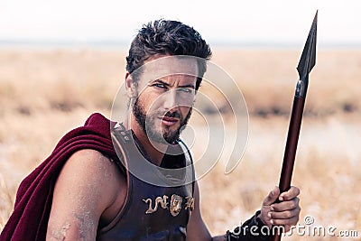 Handsome ancient warrior in armor Stock Photo