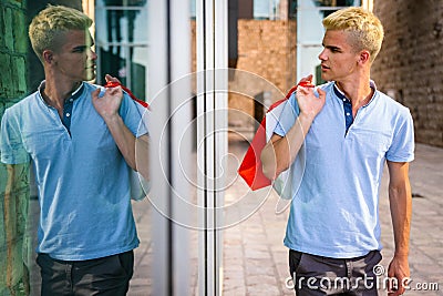 Handsome attractive man smiling shopping in the city Stock Photo