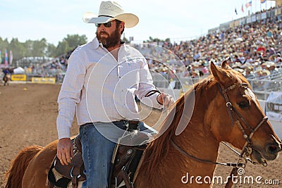 Handsome beard cowboy on horse Editorial Stock Photo