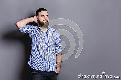 Handsome bearded man touching his hair Stock Photo