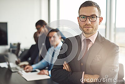 Handsome bearded professional with folded arms Stock Photo