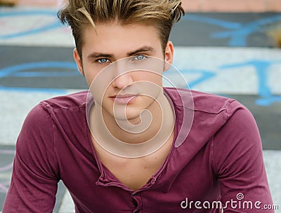 Handsome blond young man, blue eyes, looking at camera Stock Photo
