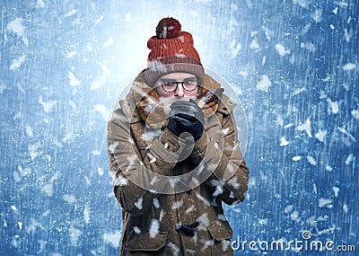 Handsome boy shivering at snowstorm concept Stock Photo