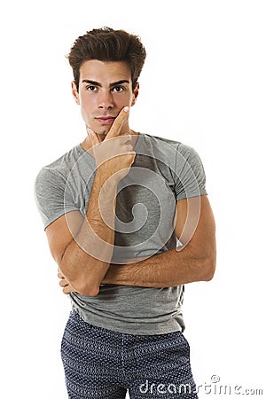 Handsome boy thinking with hand under the chin Stock Photo