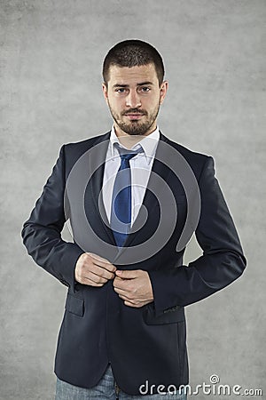 Handsome business man buttons suit Stock Photo