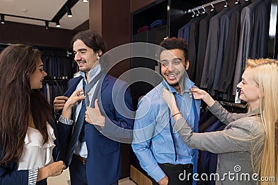 Handsome Business Man Trying Clothes Woman Fashion Shop, Customers Choosing In Retail Store Stock Photo