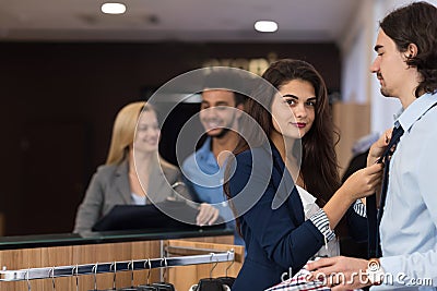 Handsome Business Man And Woman Fashion Shop, Customers Choosing Clothes In Retail Store Stock Photo