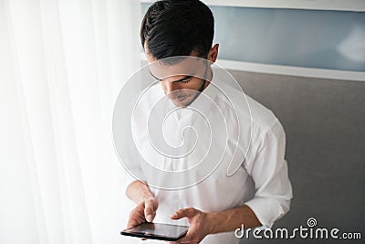 Handsome businessman doing some notices in the offic. Business and people concept Stock Photo