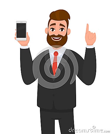 Handsome businessman holding/showing brand new smartphone/mobile/cell phone in hand and pointing index finger upside. Vector Illustration