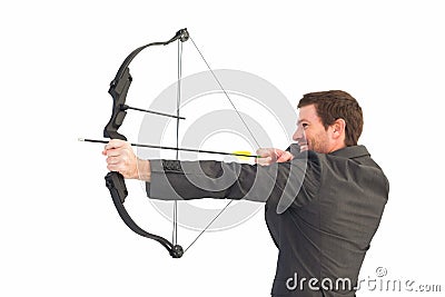 Handsome businessman shooting a bow and arrow Stock Photo