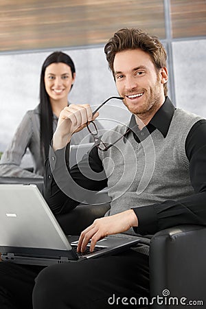 Handsome businessman smiling happily Stock Photo