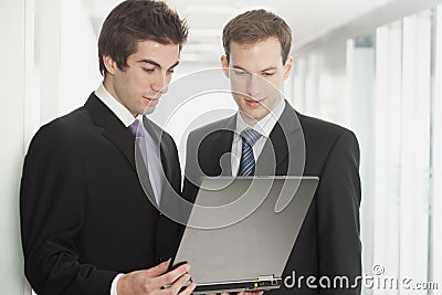 Handsome Businessmen Looking at Laptop Stock Photo