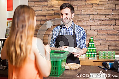 Handsome cashier enjoying his work Stock Photo