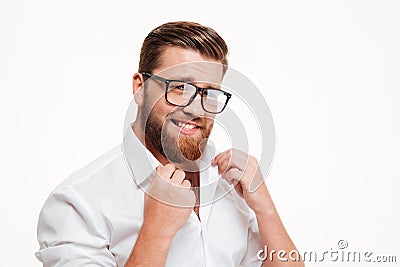 Handsome charming bearded man in eyeglasses and shirt posing Stock Photo