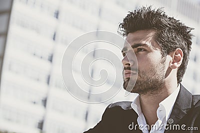 Handsome and charming young man with stylish haircut Stock Photo