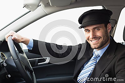 Handsome chauffeur smiling at camera Stock Photo