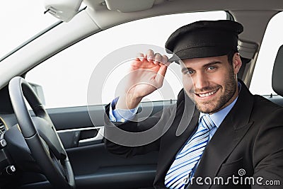 Handsome chauffeur smiling at camera Stock Photo