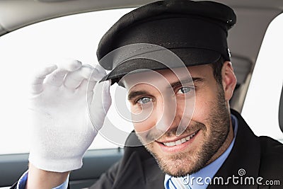 Handsome chauffeur smiling at camera Stock Photo