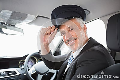 Handsome chauffeur smiling at camera Stock Photo