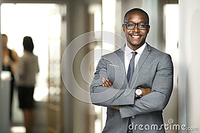 Handsome cheerful african american executive business man at the workspace office Stock Photo