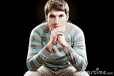 Handsome confident man isolated on black Stock Photo