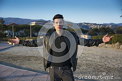 Handsome confident trendy young man celebrating Stock Photo