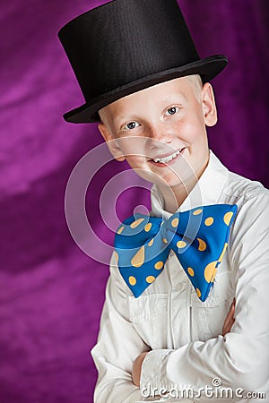 Handsome dapper young boy in a top hat Stock Photo