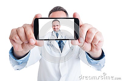 Handsome doctor or medic taking a selfie with back camera Stock Photo