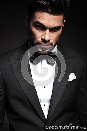 Handsome elegant business man lifting one eyebrow. Stock Photo