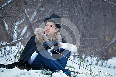 Handsome elegantyoung man with rapier, outdoor Stock Photo