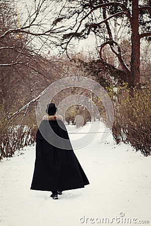 Handsome elegantyoung man with rapier, outdoor Stock Photo