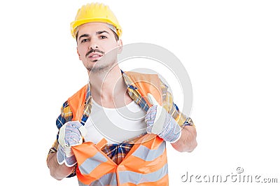 Handsome engineer acting like a super hero in his workwear Stock Photo