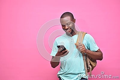 handsome excited young black man feeling excited while viewing content on his smartphone Stock Photo