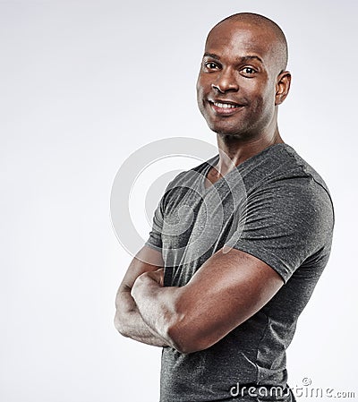 Handsome fit man with folded arms Stock Photo