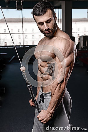 Handsome fitness model train in the gym gain muscle Stock Photo