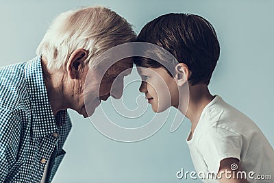 Handsome Grandpa and Grandson on Blue Background Stock Photo